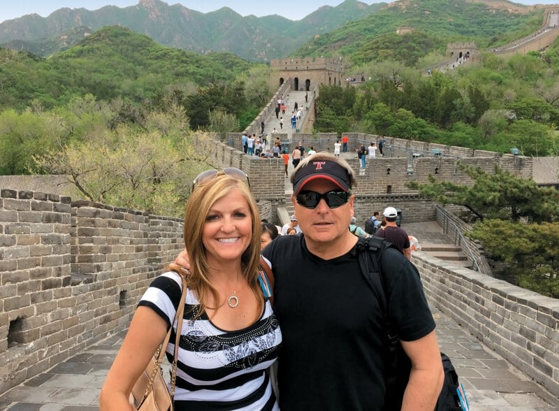 a man and woman on the Great Wall of China