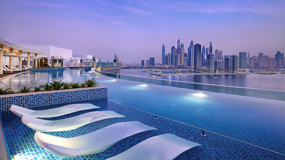 NH Collection Dubai The Palm rooftop pool and skyline view