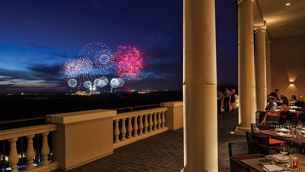 A restaurant with a rooftop terrace overlooking the fireworks at Disney World Resort
