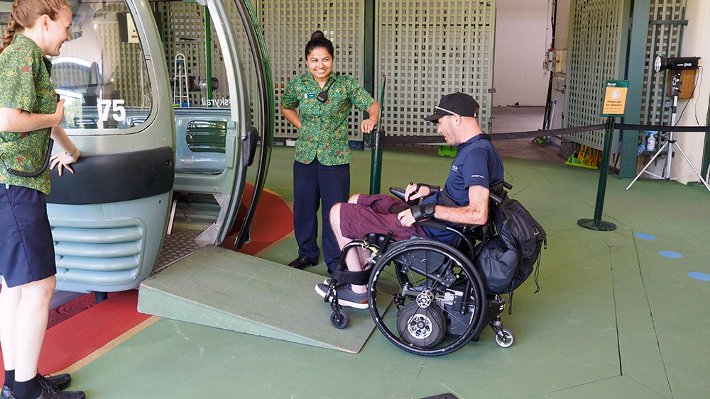 A man in a wheelchair boards the Skyrail in North Queensland