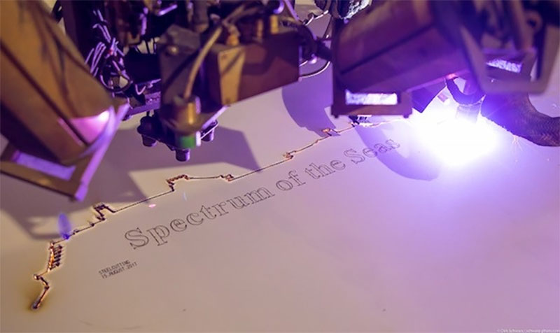 Laser inscribing the name of Spectrum of the Seas