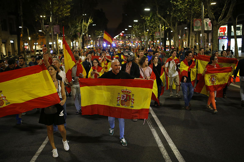 Anti-independence demonstrators waving Spanish flags march blocking main Diagonal avenue during a protest in Barcelona 