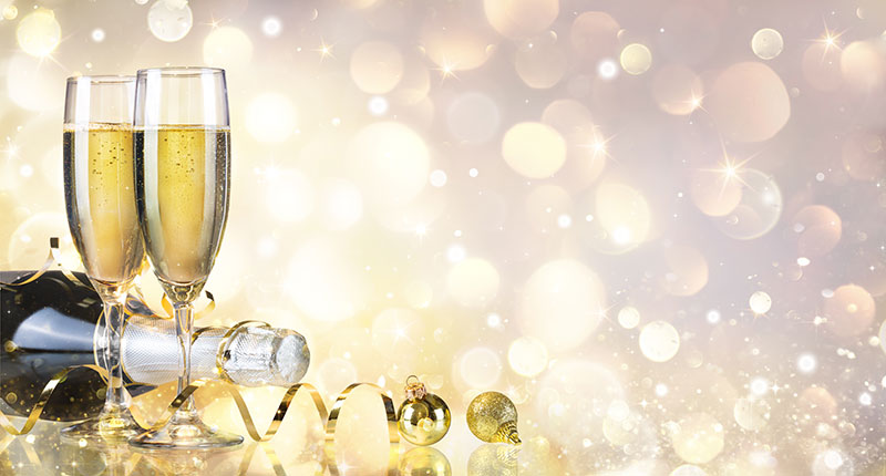 Champagne flutes against a sparkling background