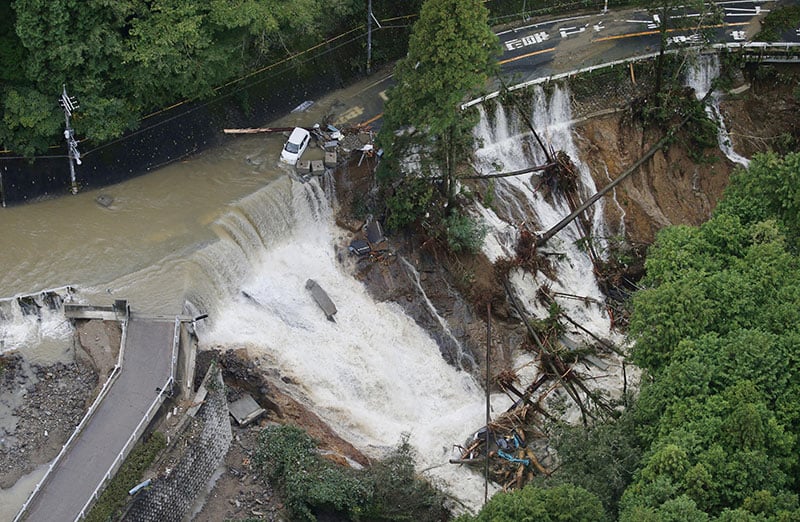 This aerial photo shows a collapsed road in Kishiwada Osaka western Japan Monday Oct 23 2017 after heavy rain brought by