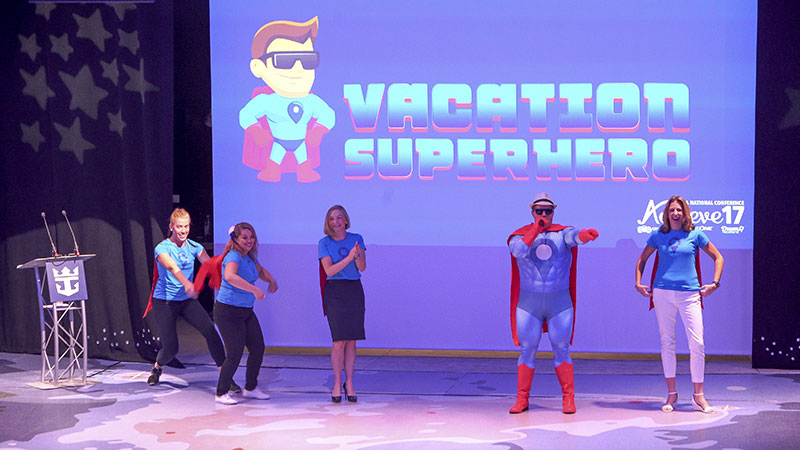 General Manager of Network Engagement and Performance Drew Daly as the Vacation Superhero with members of the marketing team