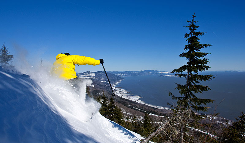 Man skiing down mountain in Quebec Canada