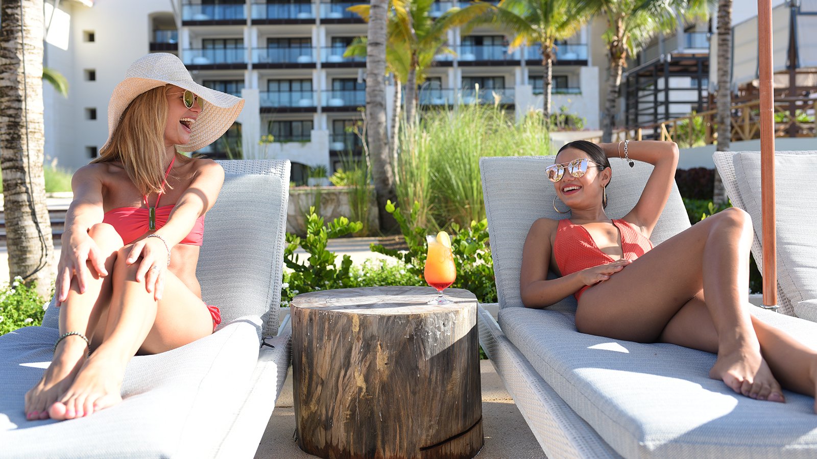 Women by the pool at UNICO 2087 Hotel Riviera Maya