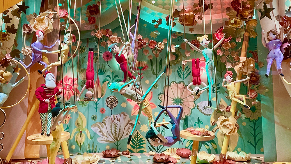Printemps Christmas window display of little circus elves performing trapeze
