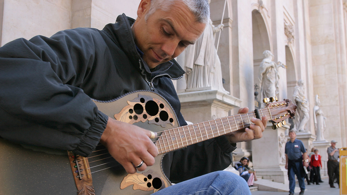 Man playing guitar in Salzburg Austria
