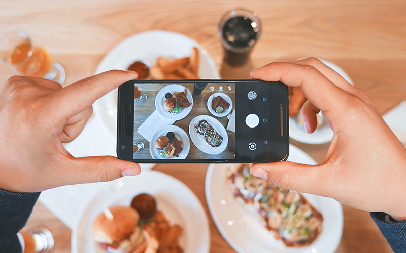 Customer takes photo of their food for social media