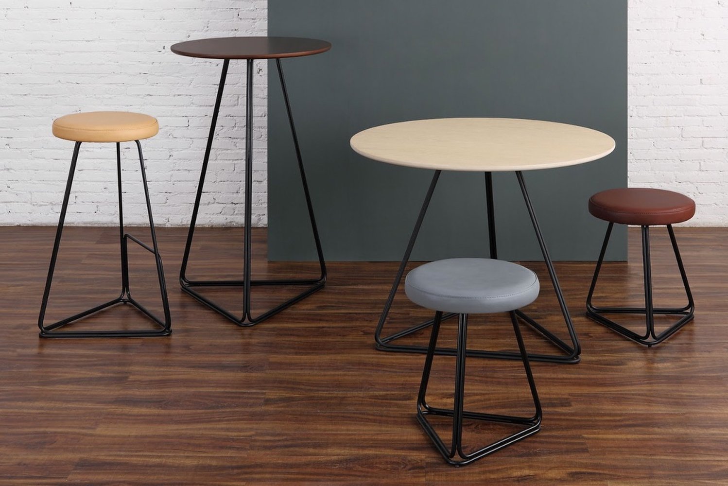 mad furniture design launched the Delta collection of tables and stools with a delta-shaped based 