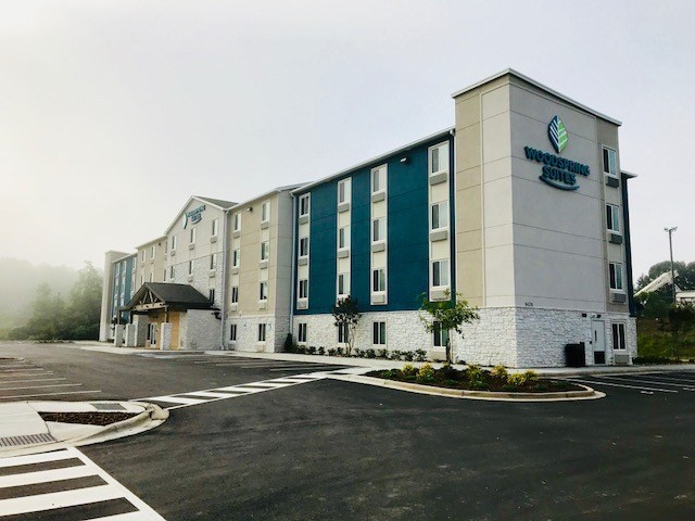 The WoodSpring Suites Charlotte Northlake and WoodSpring Suites Charlotte Matthews were opened through a collaboration betwee