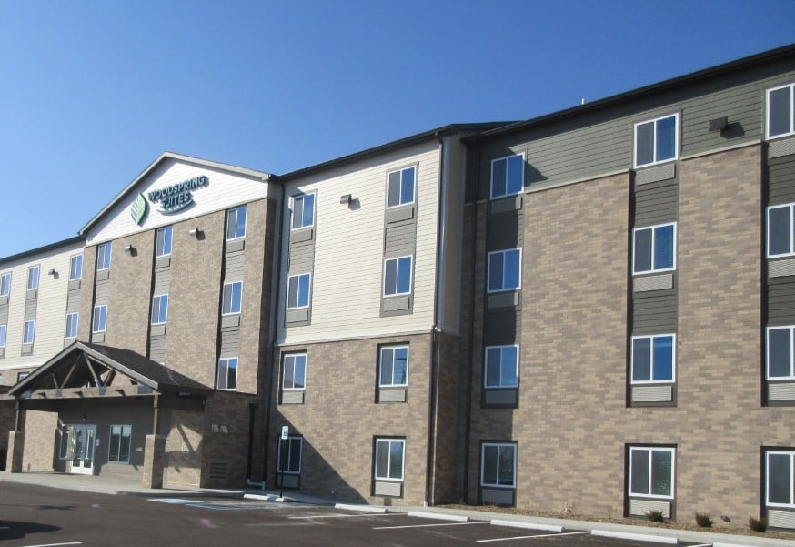 The four-story 122-room extended-stay hotel was developed by Loftus Robinson and is the first WoodSpring Suites to join the