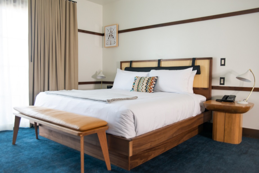 A Huntington Lodge guestroom featuring mostly wood furniture
