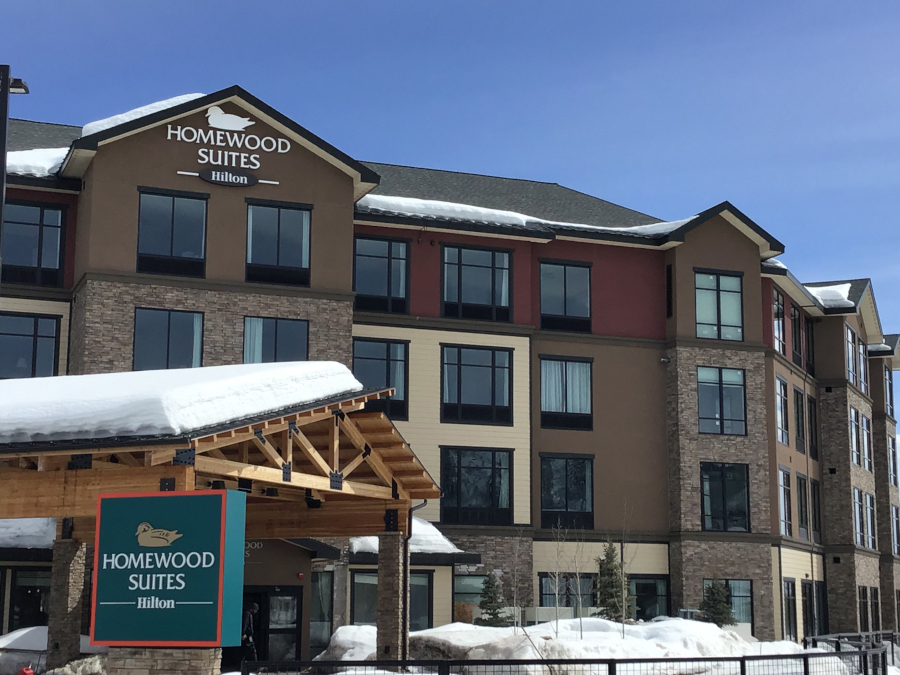 Exterior of Homewood Suites by Hilton Steamboat Springs with snow on the roof