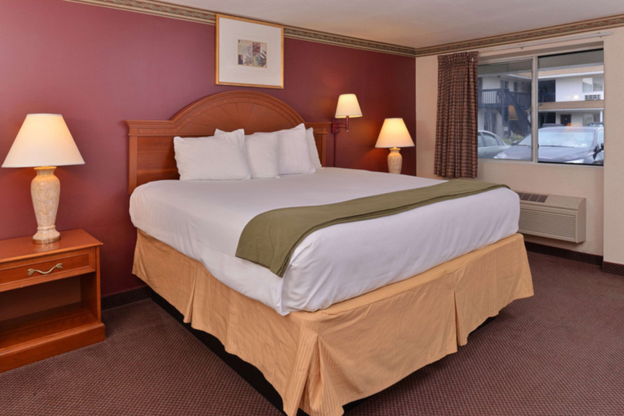A guestroom at AmeriVu Inn and Suites Wolcott