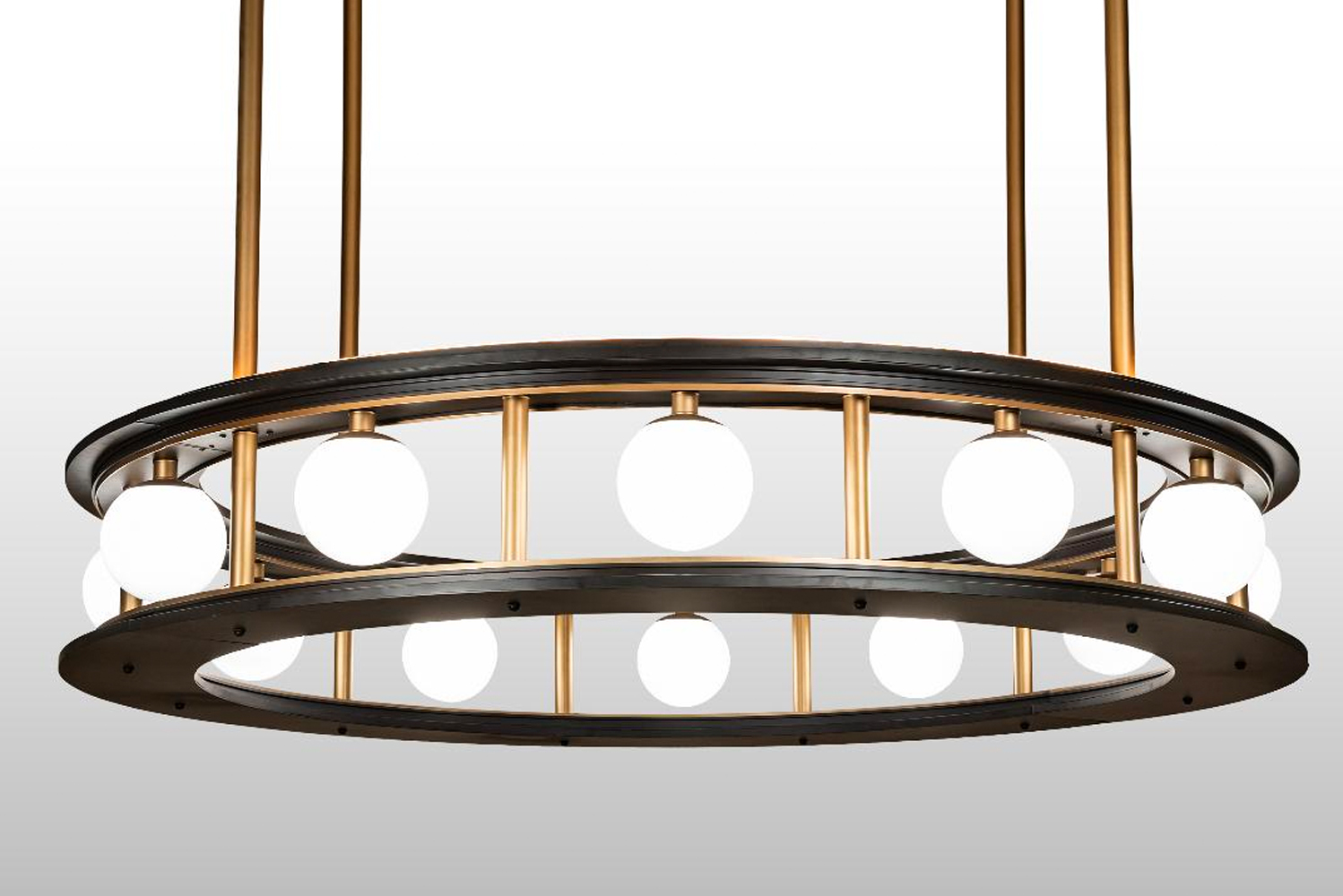 The pendant is engineered in sections and can be assembled on-site to encompass a column at the location