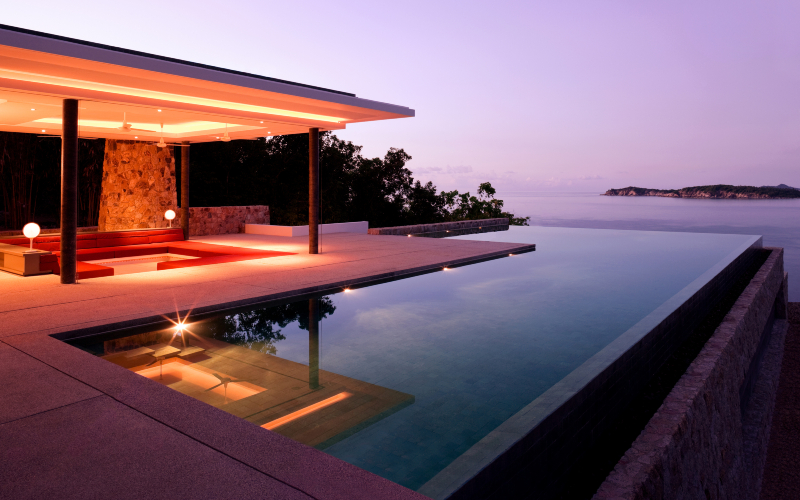 Luxury Island Villa Home In The Tropics Along The Coastline At Sunrise