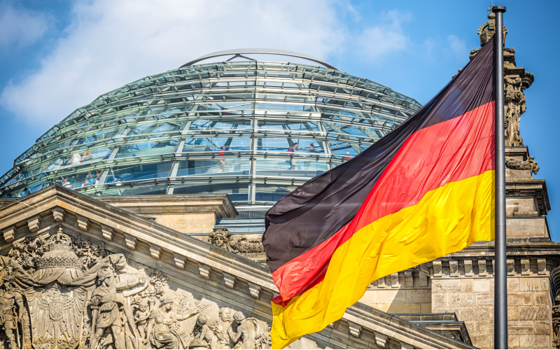 Reichstag in Berlin with German Flag