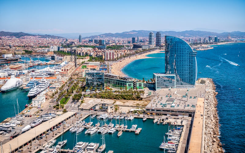 Front of Barcelona from the air with the Port Vell the business center and the hotel