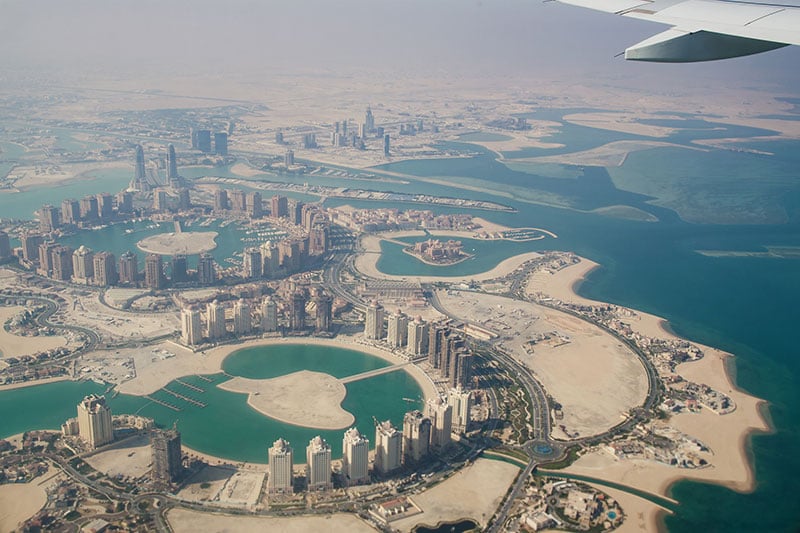Airplane flying over Doha Qatar
