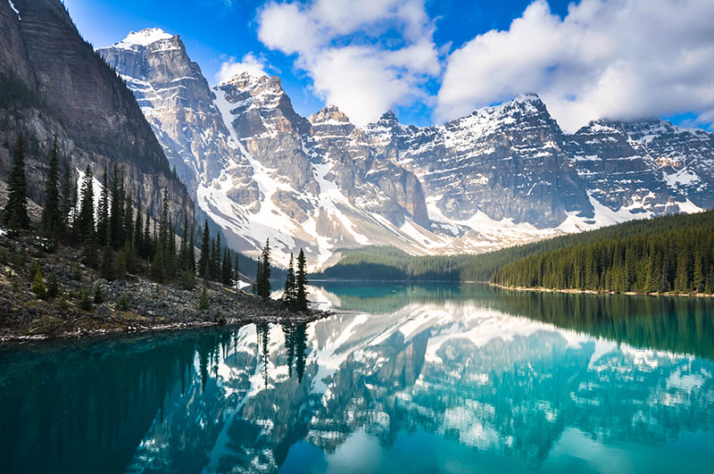 The Rocky Mountains reflected in Moraine Lake in Canada