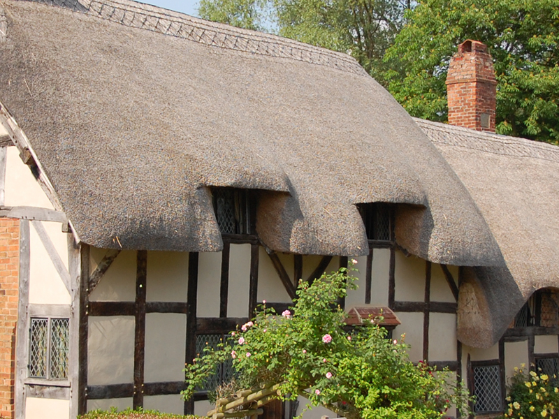 The thatched roof of Anne Hathaways Cottage where Shakespeares wife grew up seems to drip over the 500-year-old building