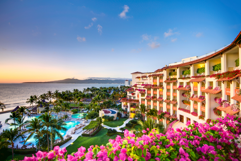 An exterior view of Grand Velas Riviera Nayarit with the water next to it