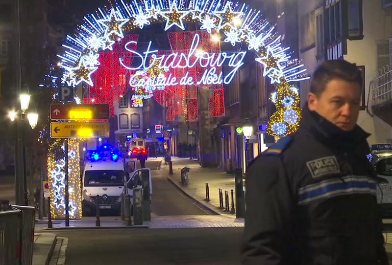 In this image made from video emergency services arrive on the scene of a Christmas market in Strasbourg France
