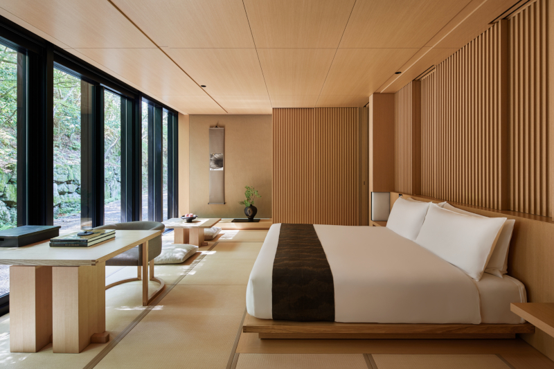 A guest room at Aman Kyoto with a large room-length window 