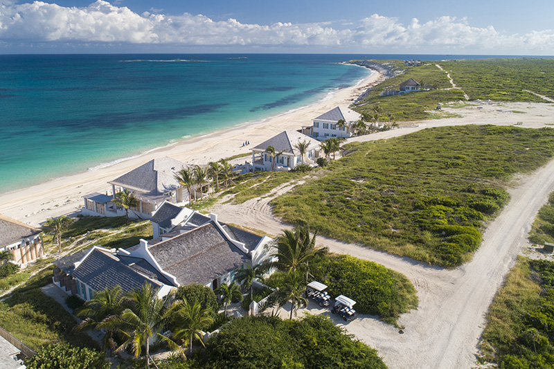 The suites at Ambergris Cay lined up along the beach