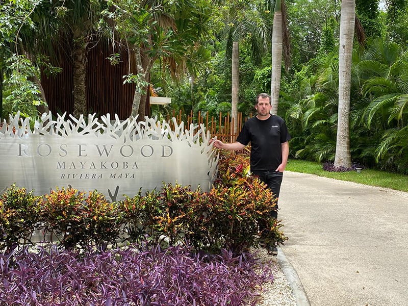 Dylan Clements at the entrance of Rosewood Mayakoba