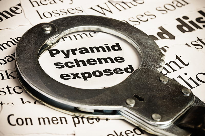 pyramid scheme exposed with handcuffs