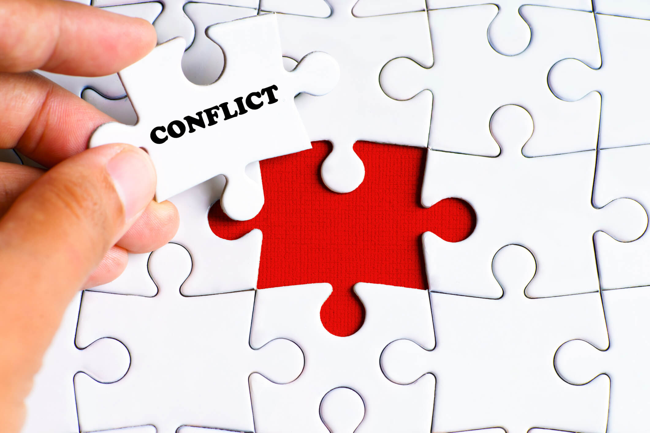 Puzzle piece that says conflict