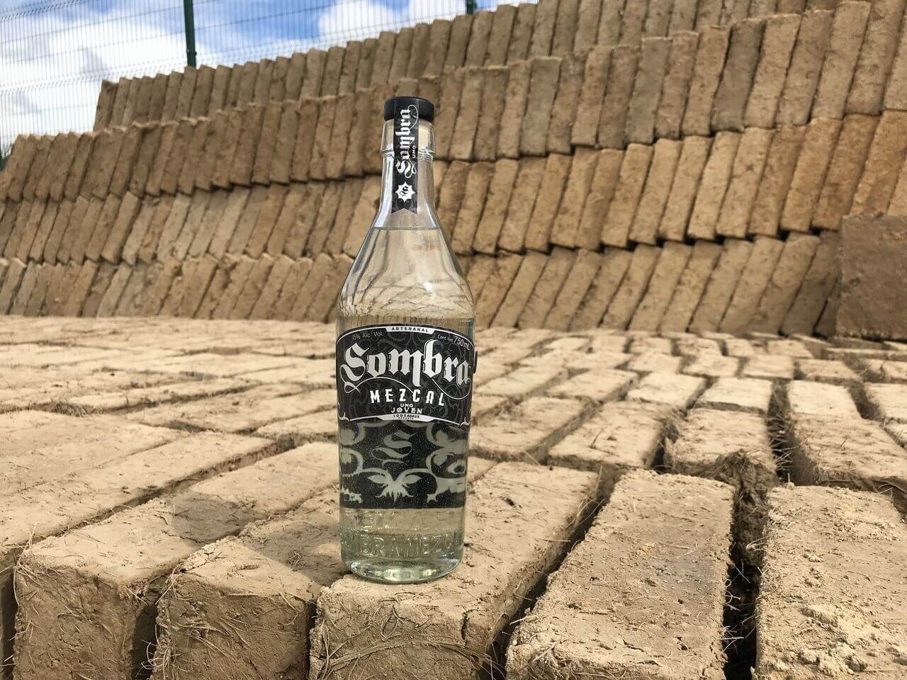 Sombra Mezcal bottle on steps