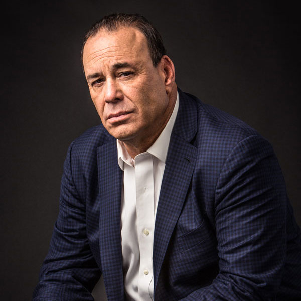 Jon Taffer of Bar Rescue headshot in blue checkered suit with white shirt