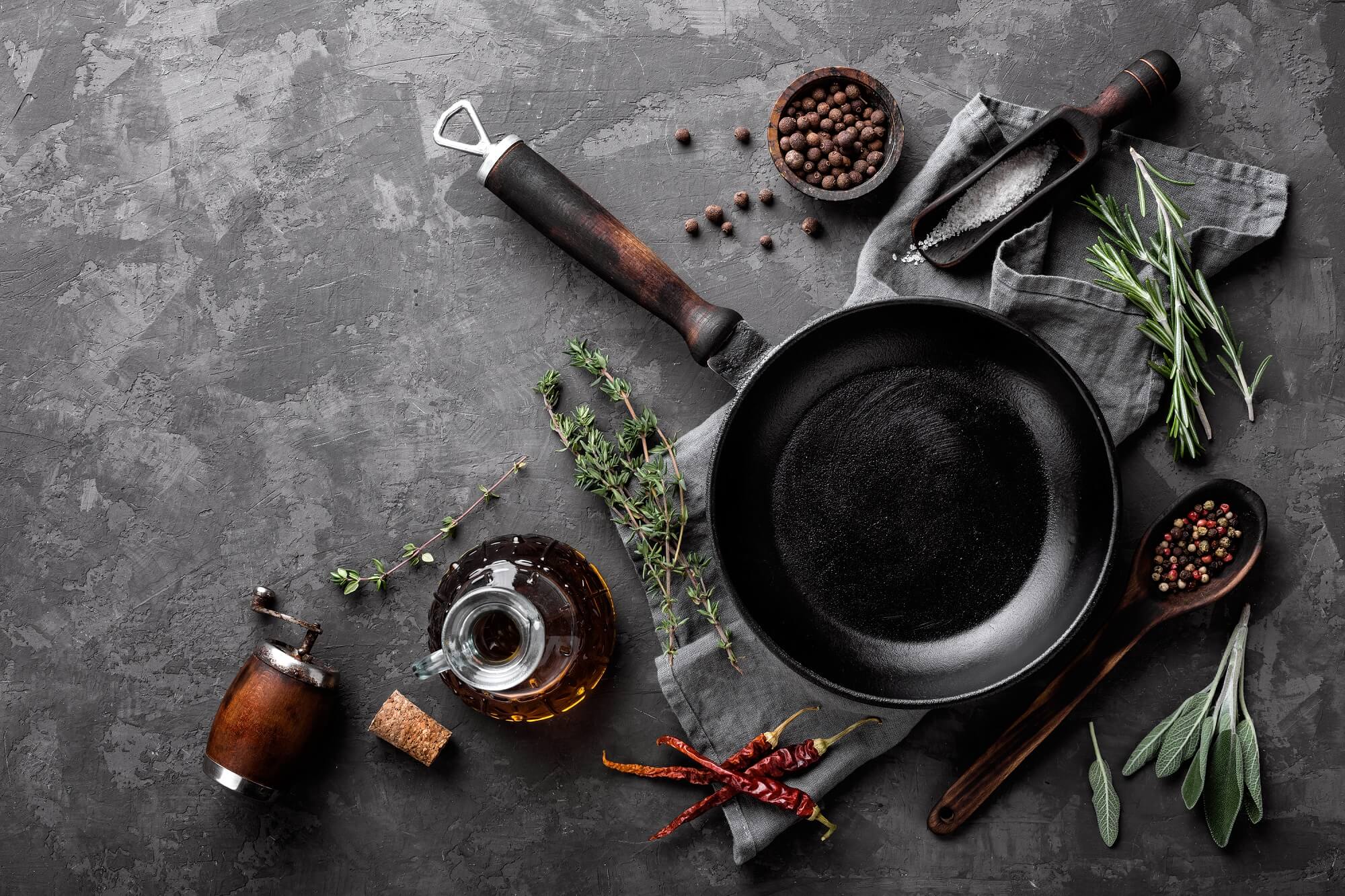 Culinary background with cast iron skillet