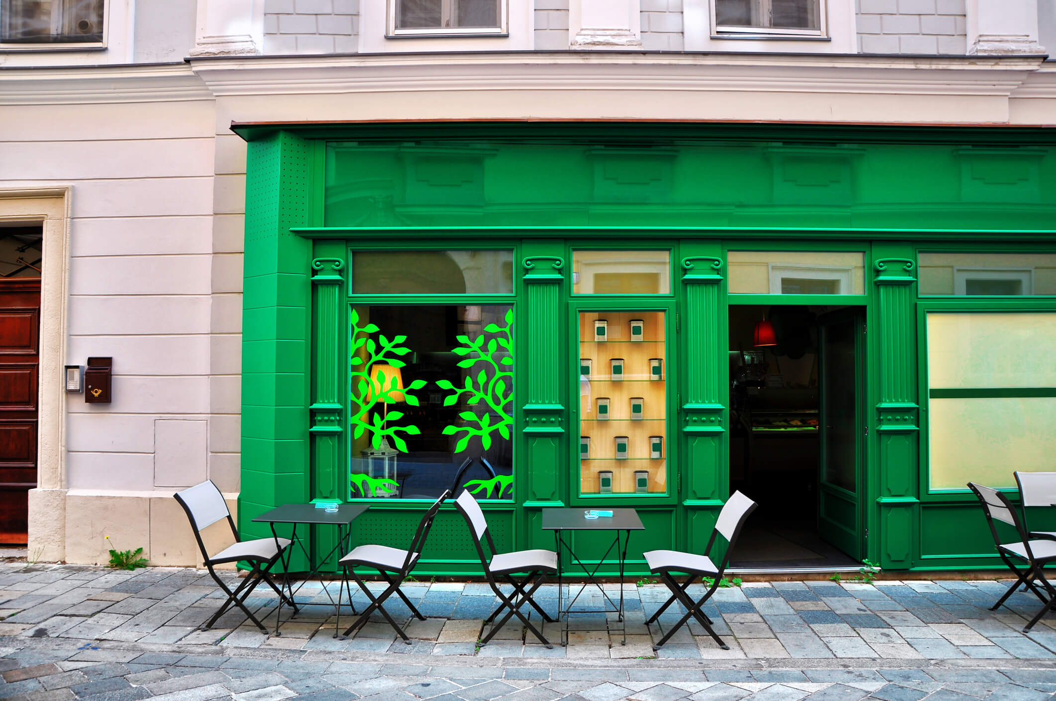 Green restaurant with sidewalk seating