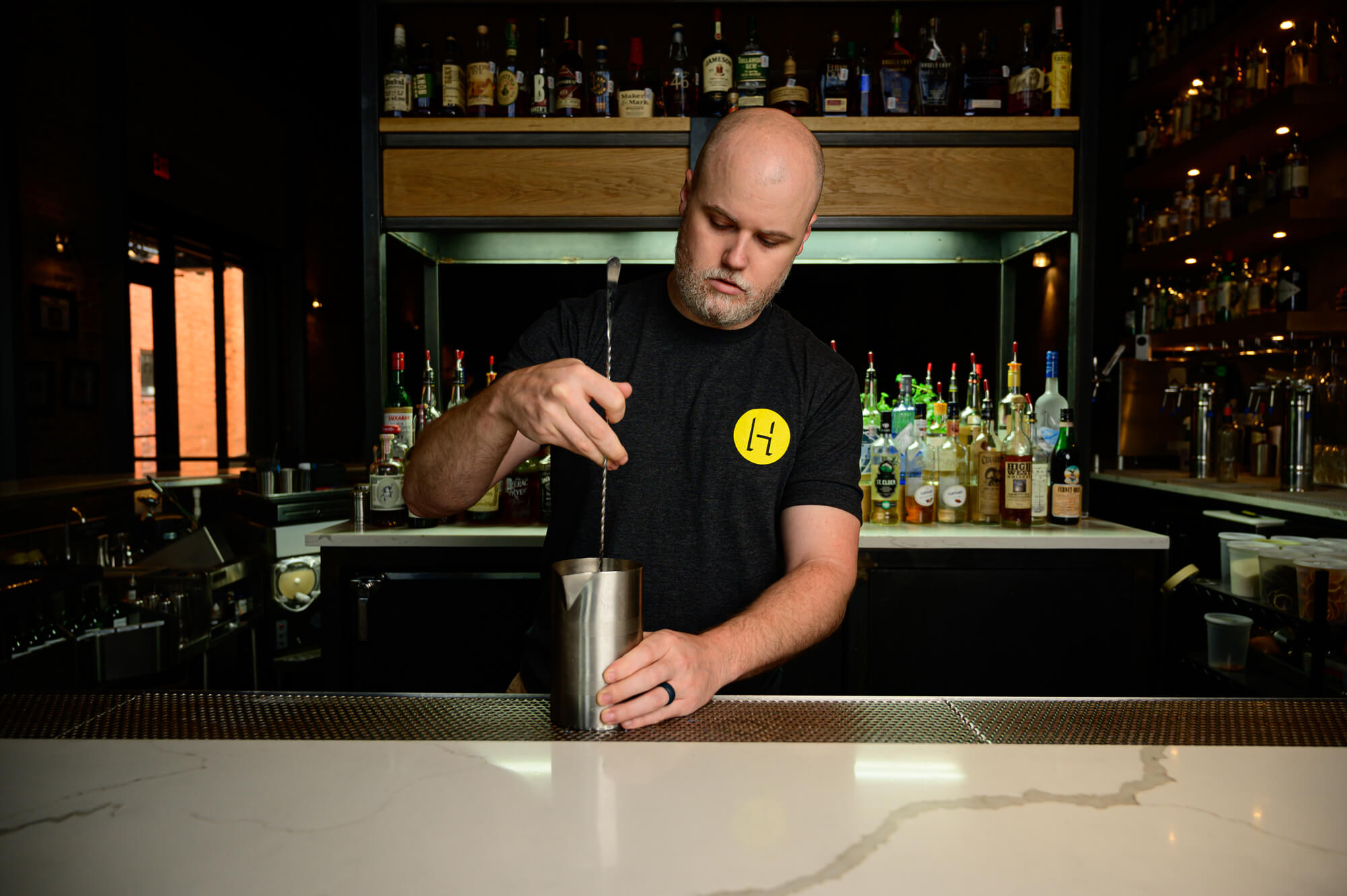 Scott Jenkins of HIDE Bar in Dallas stirring a cocktail