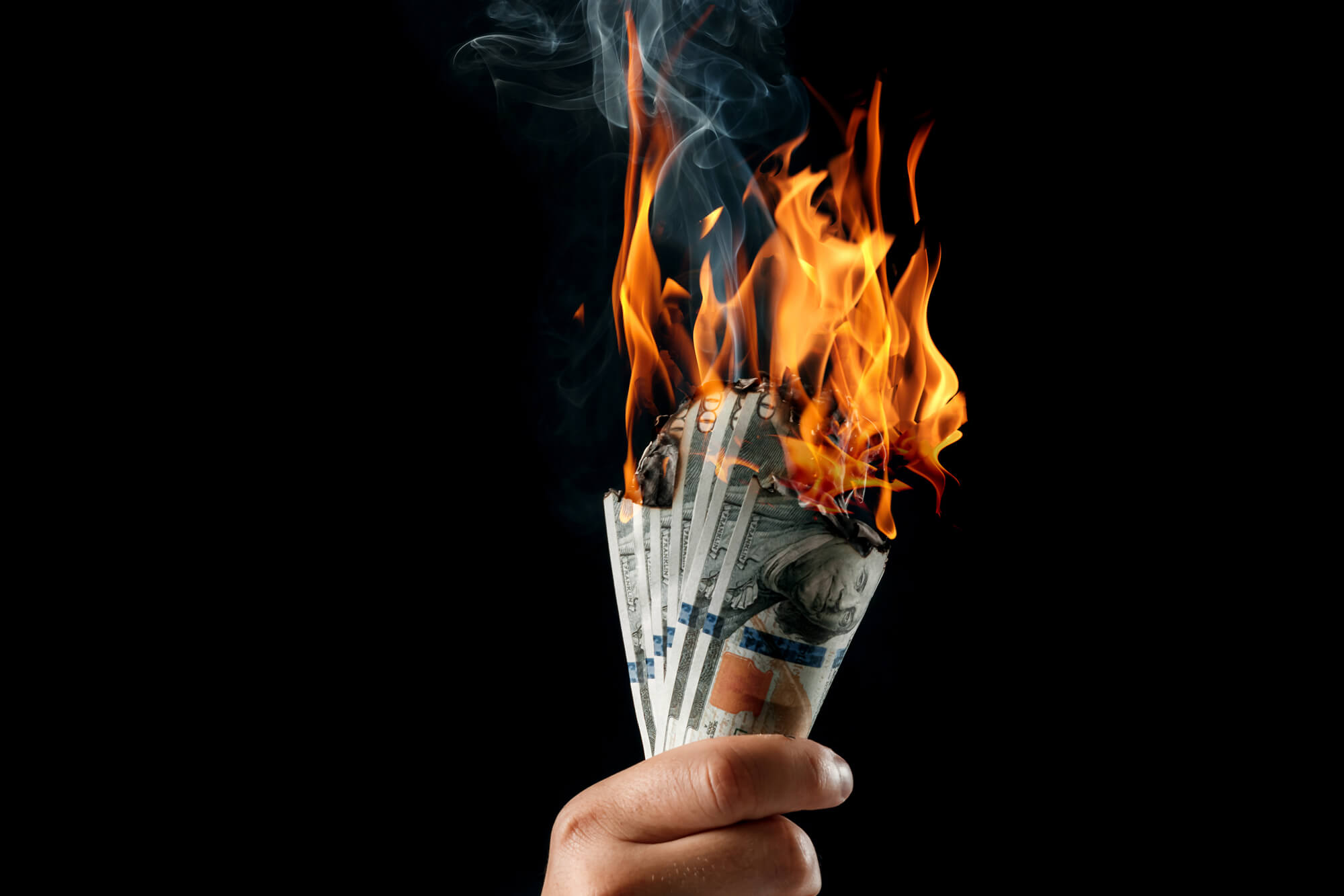 Fistful of money burning