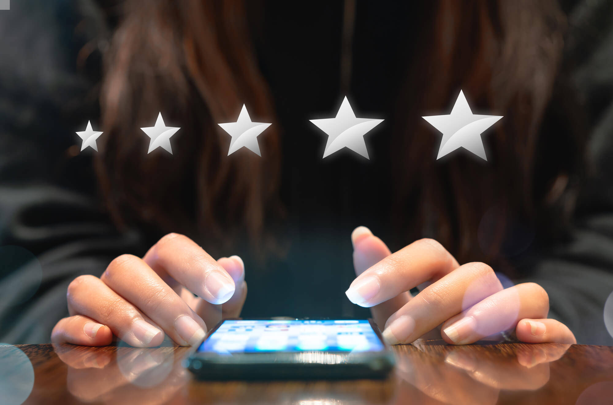 Woman rating a bar on mobile device