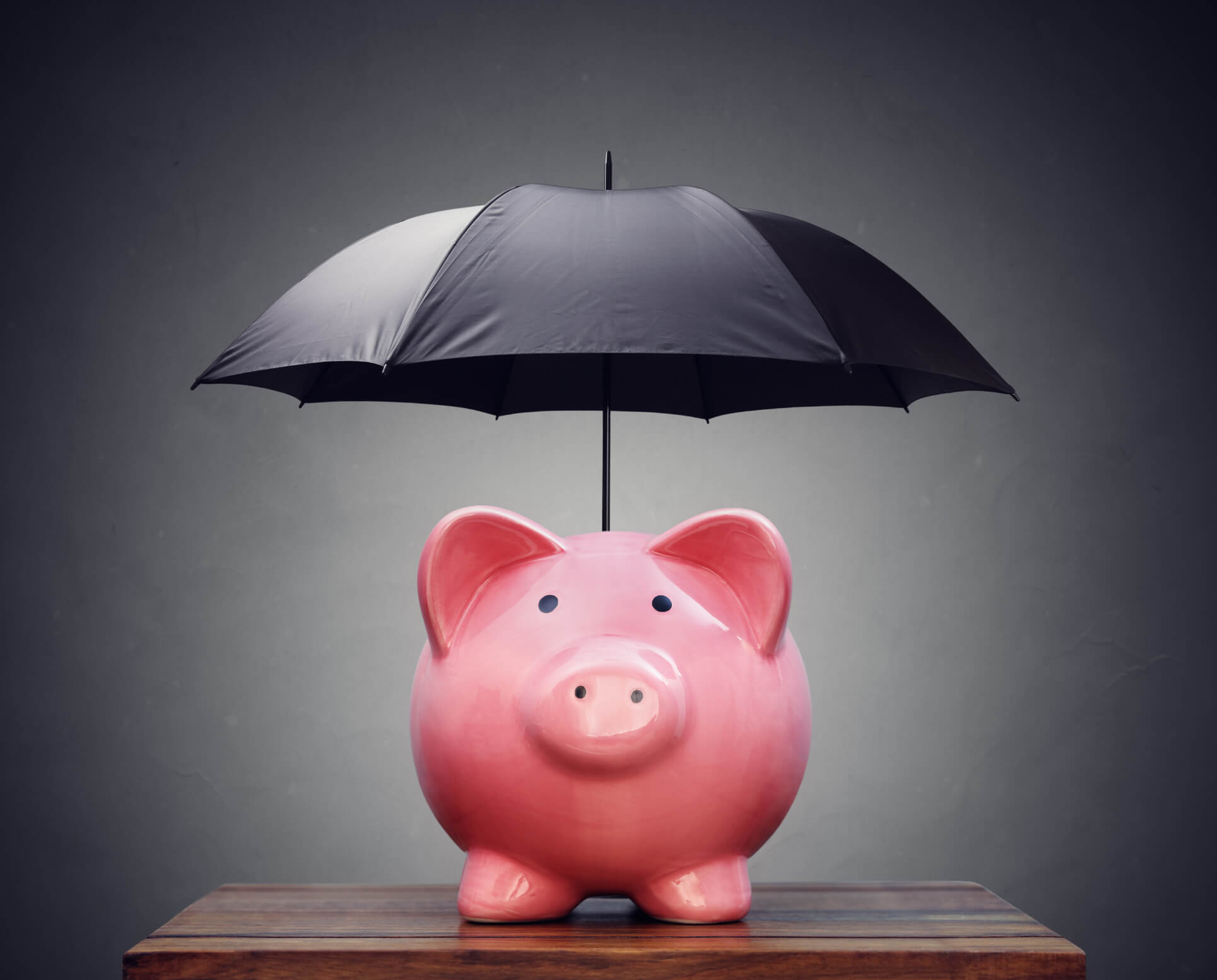 Piggy bank and umbrella concept