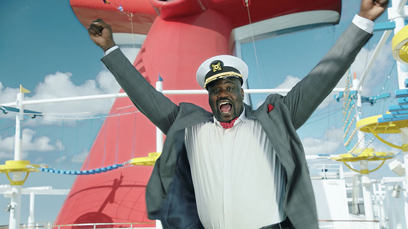 Shaquille ONeal standing on a Carnival cruise ship