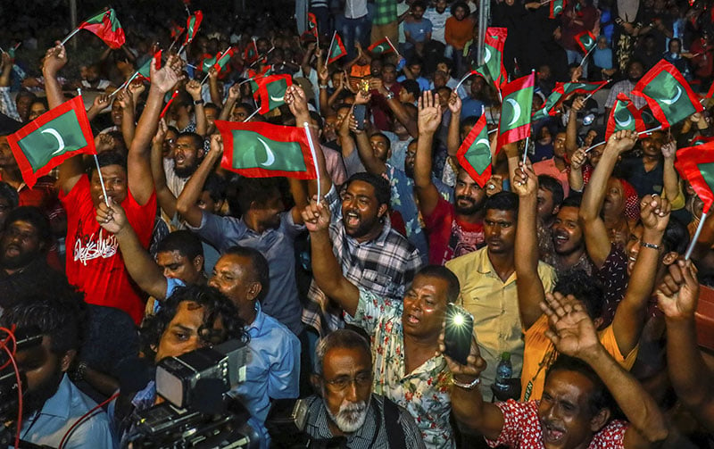 Maldivian opposition protestors shout slogans demanding the release of political prisoners during a protest in Male Maldives