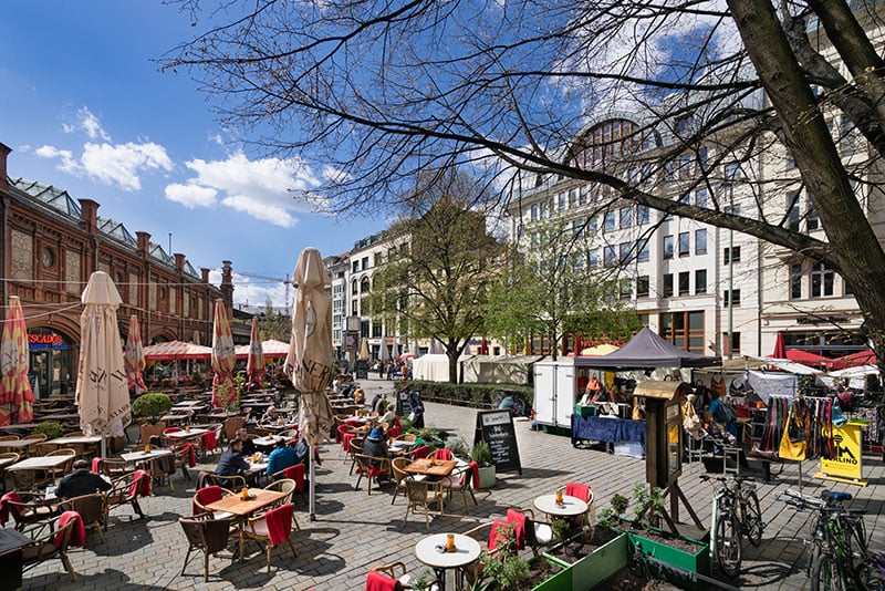 The shopping area Hackescher Markt on a sunny spring day with restaurants and small shops offering products often designed b