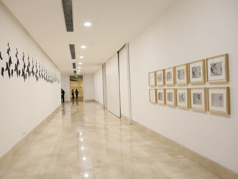Visitors observe museum exhibition