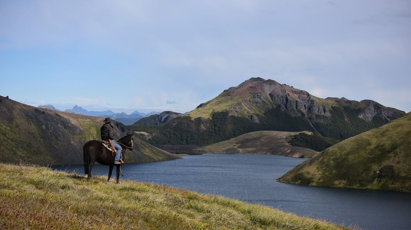 Man rides a horse on a mountain 
