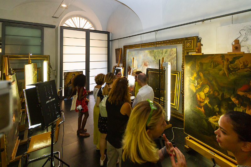 Visitors looking at paintings on the Restoring Caravaggio Tour 