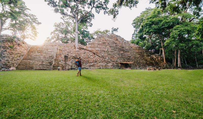 A man walks in front of ruins in Honduras