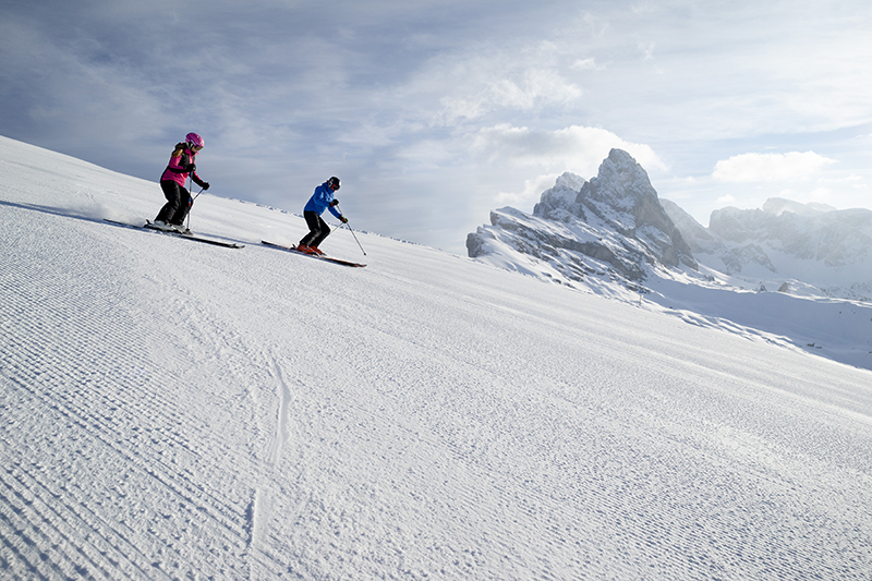 pair skiing in the Dolomites